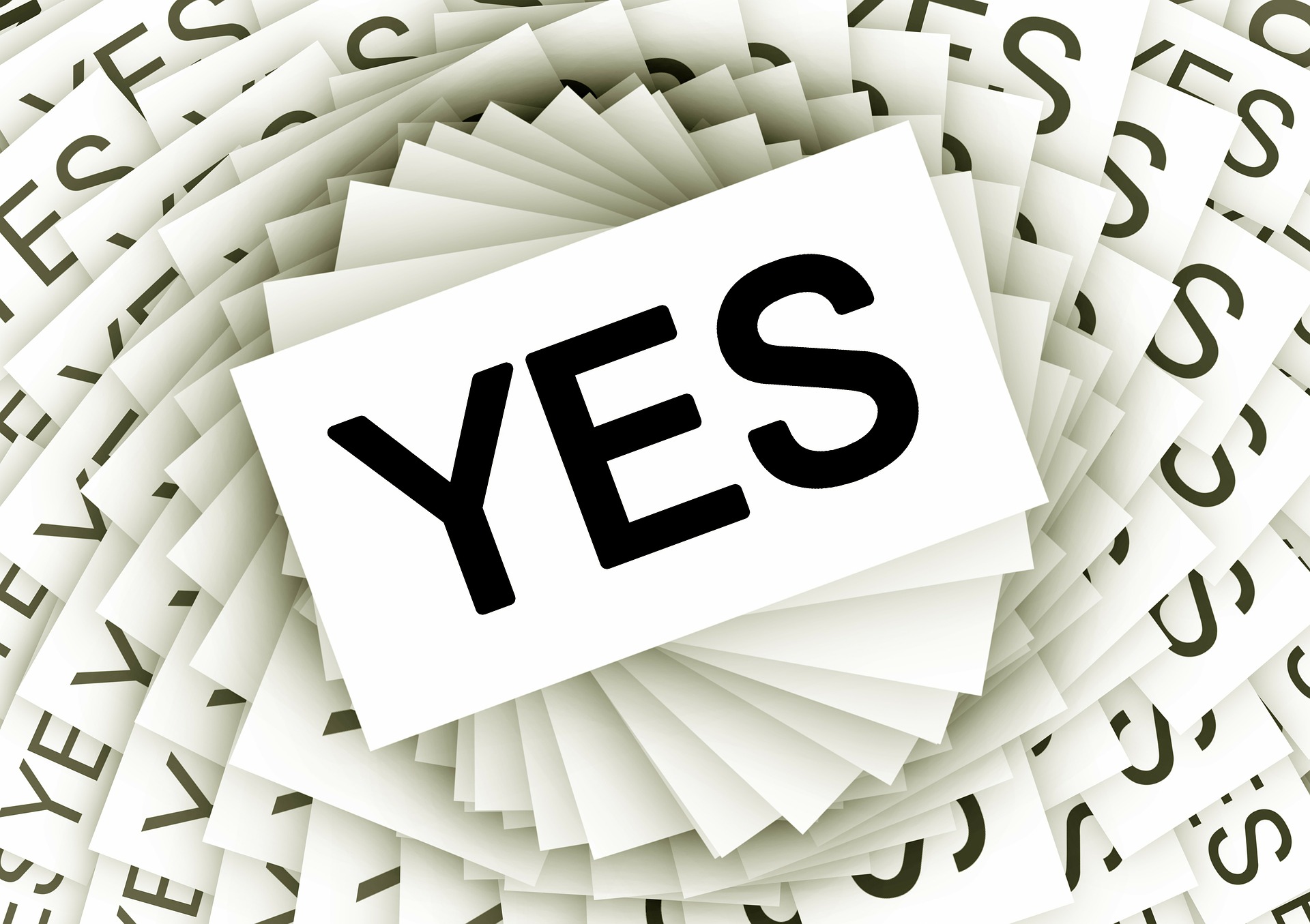 Copies of yes printed on many pieces of paper