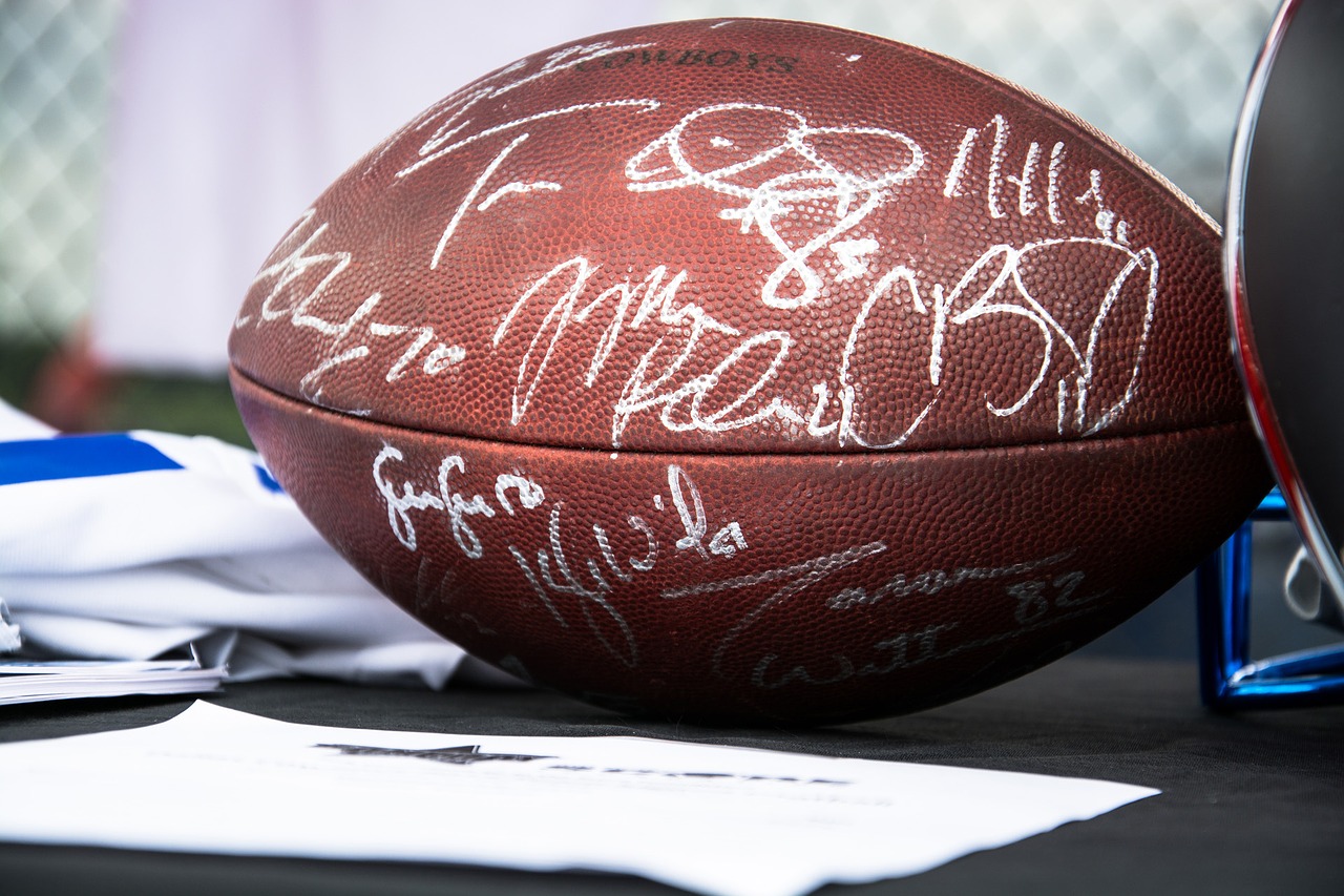 A signed football sitting on a desk