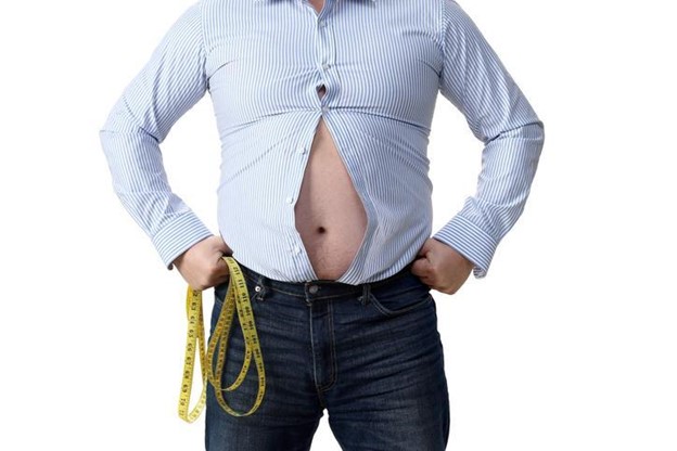 Big_belly A man’s shirt is unbuttoned exposing his belly.